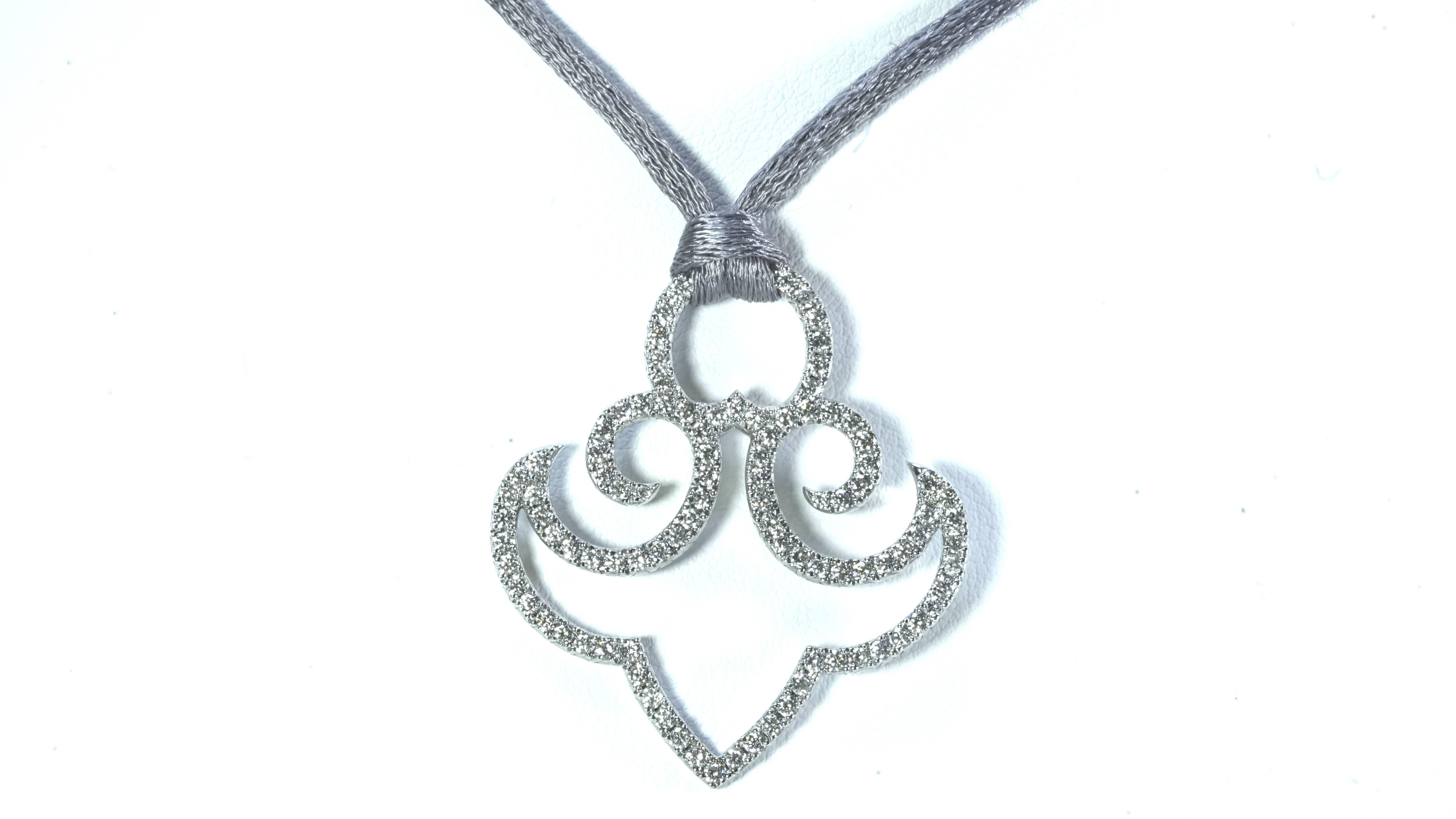 A delicate anchor pendant composed by 18k white gold and white diamonds.
Created by Marion Jeantet, French assay mark and signed.
Chain weight: 2.61grs, 45.5cm lenght
Pendant weight: 5.25grs, 
Loop weight: 0.72gr
White diamonds weight: 1.75ct