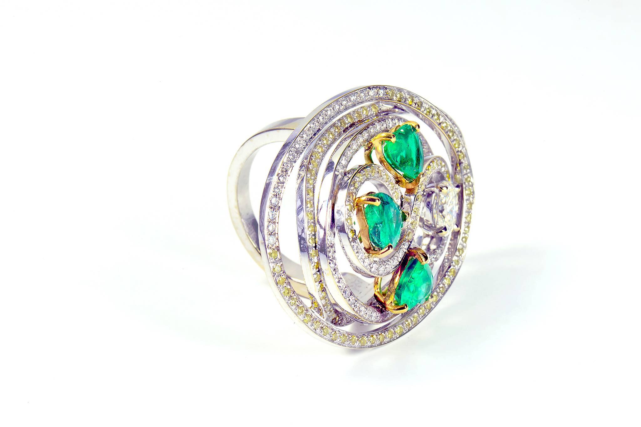 Round Cut Tourbillon Ring in 18K White Gold Set With Emeralds and Diamonds For Sale
