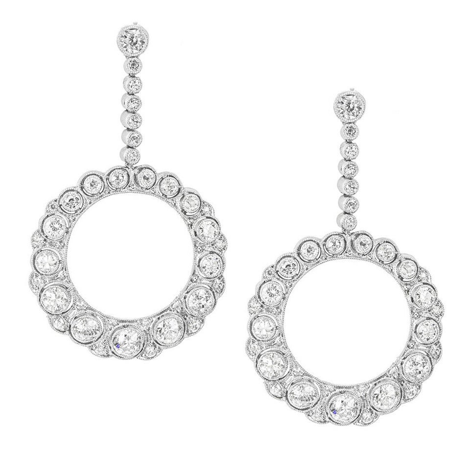 A pair of early 20th century diamond-set hoop drop earrings