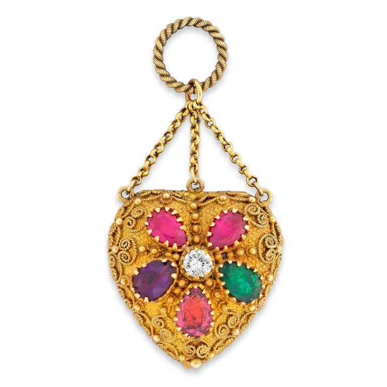 A Georgian REGARD and gold heart locket, the front set with pear shaped rubies, emerald, garnet, amethyst around a round brilliant-cut diamond, spelling the word REGARD, the back set with three turquoise all to a granulated yellow gold mount with
