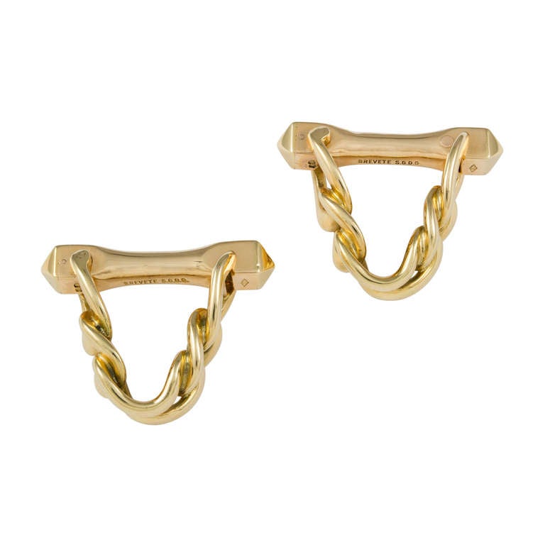 A pair of Boucheron heavy chain stirrup yellow gold cufflinks, signed Boucheron Paris and stamped 27338, circa 1920, measuring approximately 2 x 2.5cm, gross weight 16.64 grams, illustrated in 