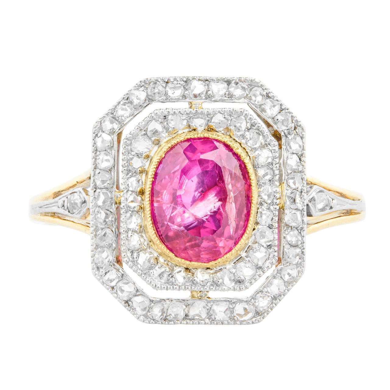 An Edwardian Burmese pink sapphire and diamond cluster ring