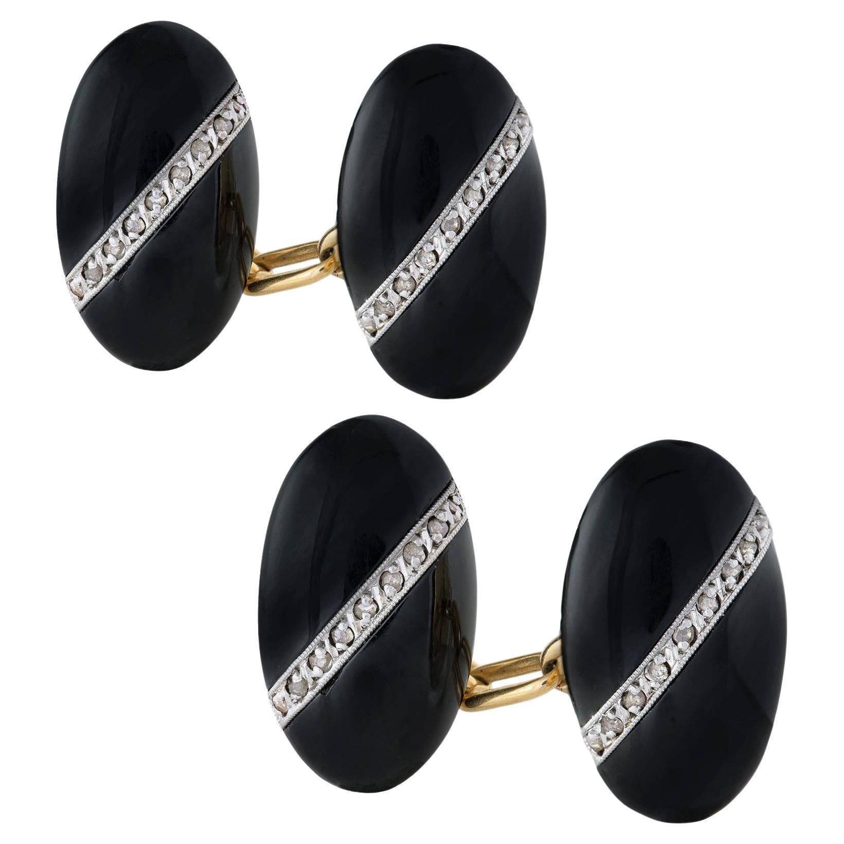 A pair of French Art Deco onyx and diamond cufflinks