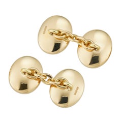 Une paire de boutons de manchette en or jaune et lapis-lazuli