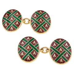 Une paire de boutons de manchette vintage en émail de la marque Asprey