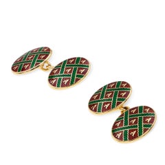 Une paire de boutons de manchette vintage en émail de la marque Asprey