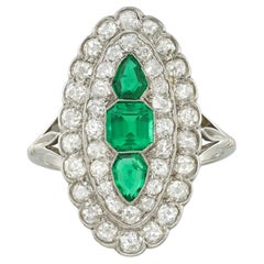 An Art Deco emerald and diamond marquise plaque ring