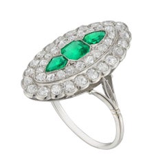 An Art Deco emerald and diamond marquise plaque ring
