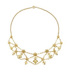 An Edwardian split pearl and gold festoon necklace