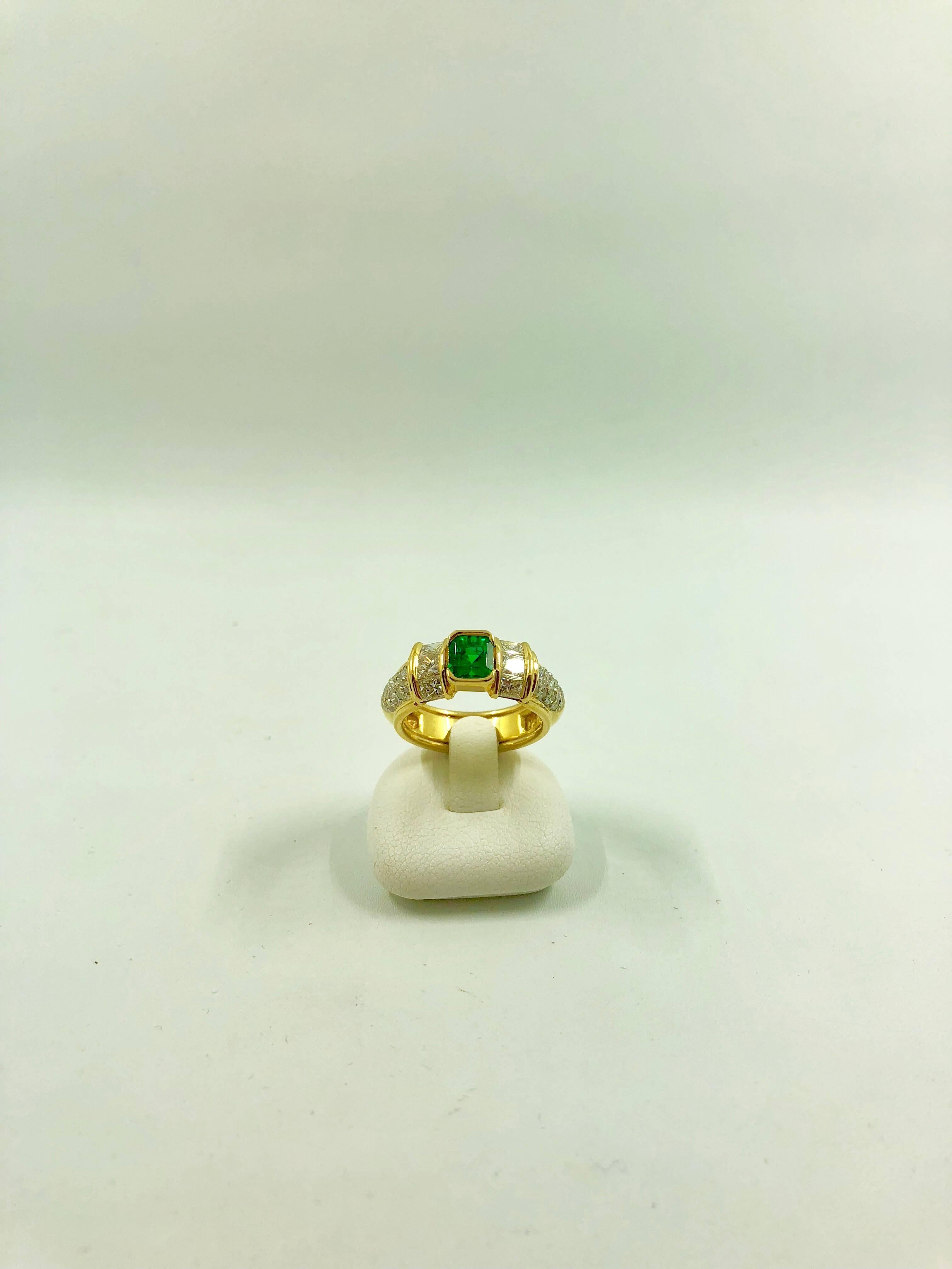 A yellow gold ring set in the middle with a stunning Zambian Emerald surrounded by 3 princess cut diamonds and 13 brilliant cut diamonds on each side.
The ring is a G.MINNER unique creation, entirely handmade,
Emerald Weight: 0.79 carat
-Total