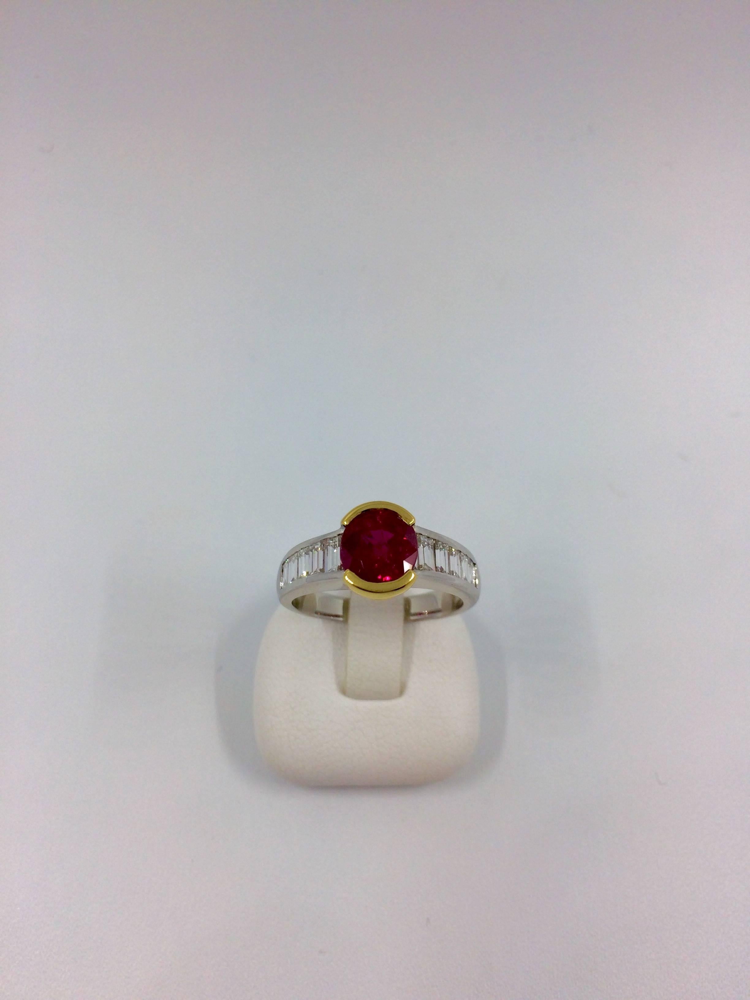 A white and yellow gold ring set in the middle with a stunning burma ruby surrounded by 5 baguette cut diamonds on each side.
Diamonds Quality: F/VS
Diamonds Total Weight: 0,96 carat
Ruby Weight: 2,42 carat
Net Weight: 5,10 grams
Finger size: 7