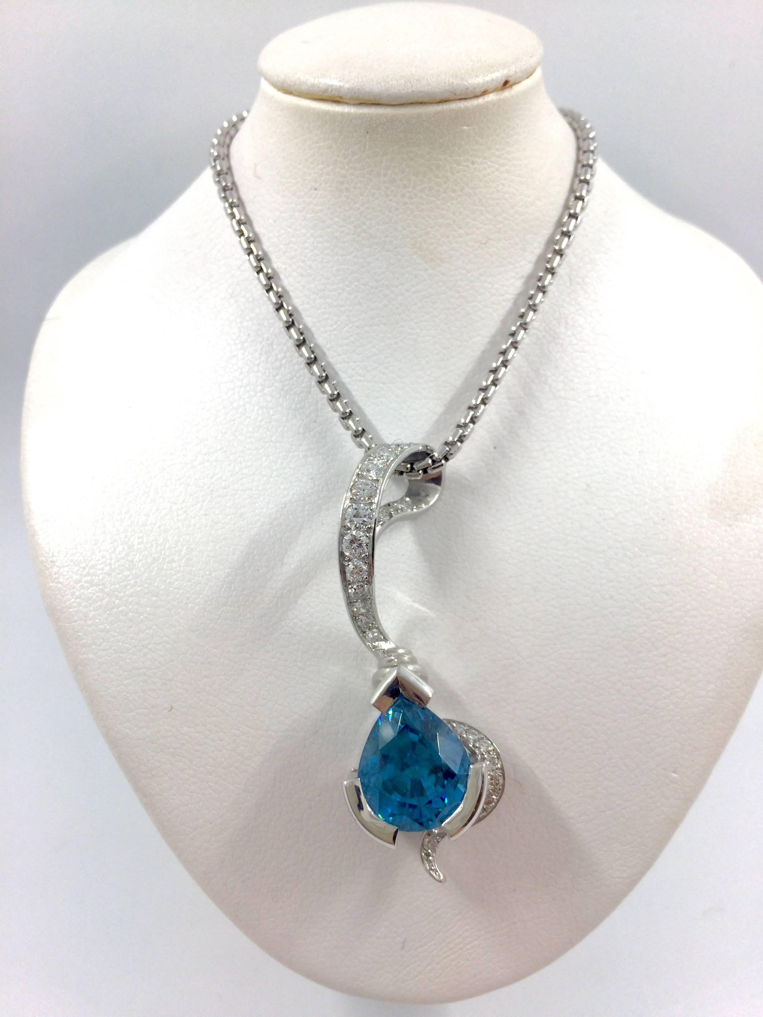 A white gold pendant set with a stunning cambodia blue zircon surrounded by brilliant cut diamonds. This unique pendant is a creation entirely handmade.
Zircon Weight: 8,66 carat
Total Diamond Weight: 0,69 carat
Diamonds Quality: E/VVS
Net
