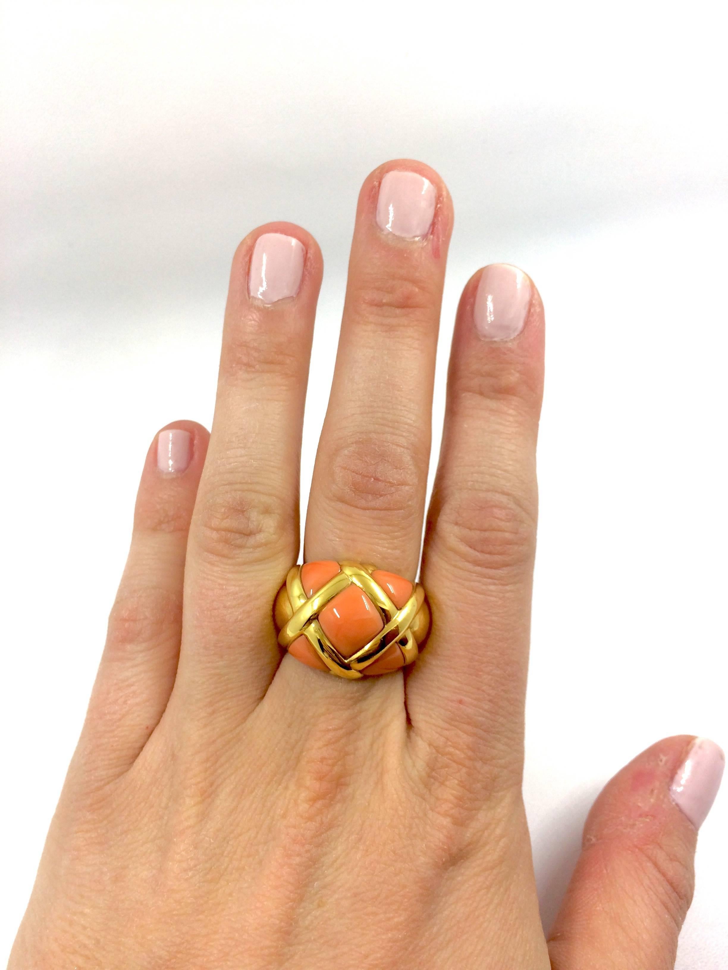 A yellow gold ring composed with coral.
Net Weight: 17.60 grams
Finger Size: 6.6 (can be sized)