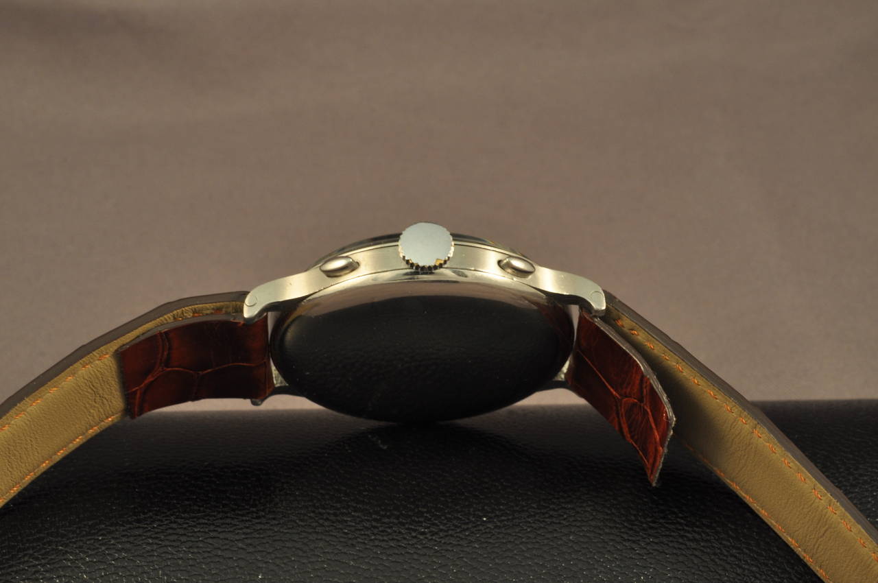 Very rare and fine Stainless steel manual winding chronograph wristwatch with an amazing black gilt dial.