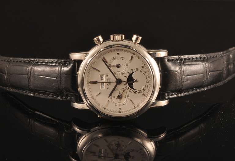 Patek Philippe platinum perpetual calendar chronograph wristwatch with moonphase, Ref. 3970P, circa 1990. Accompanied by the original box and papers.