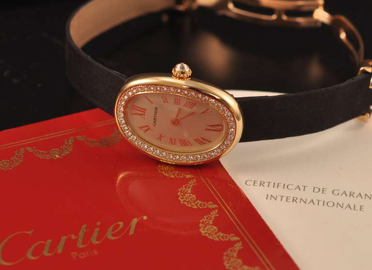 Cartier lady's 18k yellow gold and diamond wristwatch, quartz movement.
Accompanied by the original box and papers.