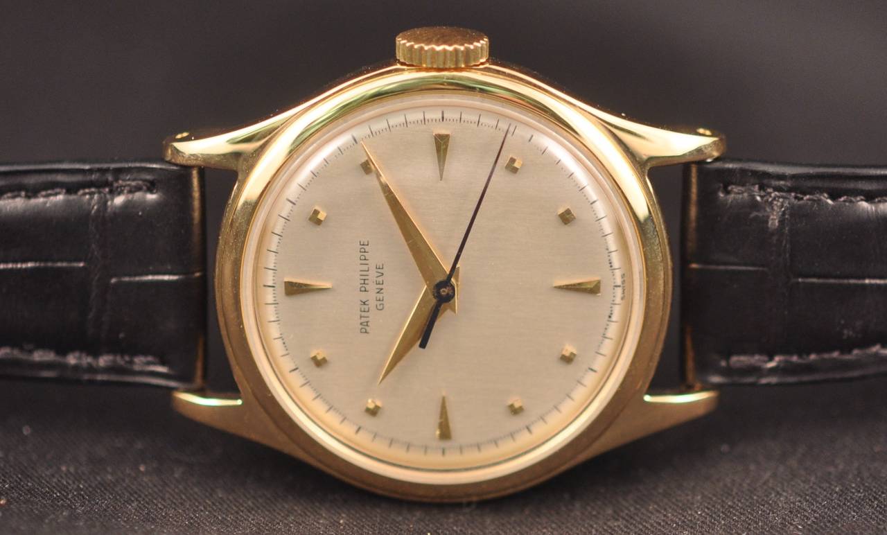 Rare and fine 18k yellow gold cream dial manual winding (Cal 27-SC, Geneva Seal) wristwatch circa 1954