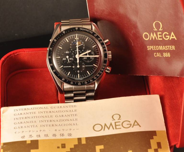 Omega stainless steel Speedmaster Moonphase chronograph wristwatch, with original box and papers, circa 1986.