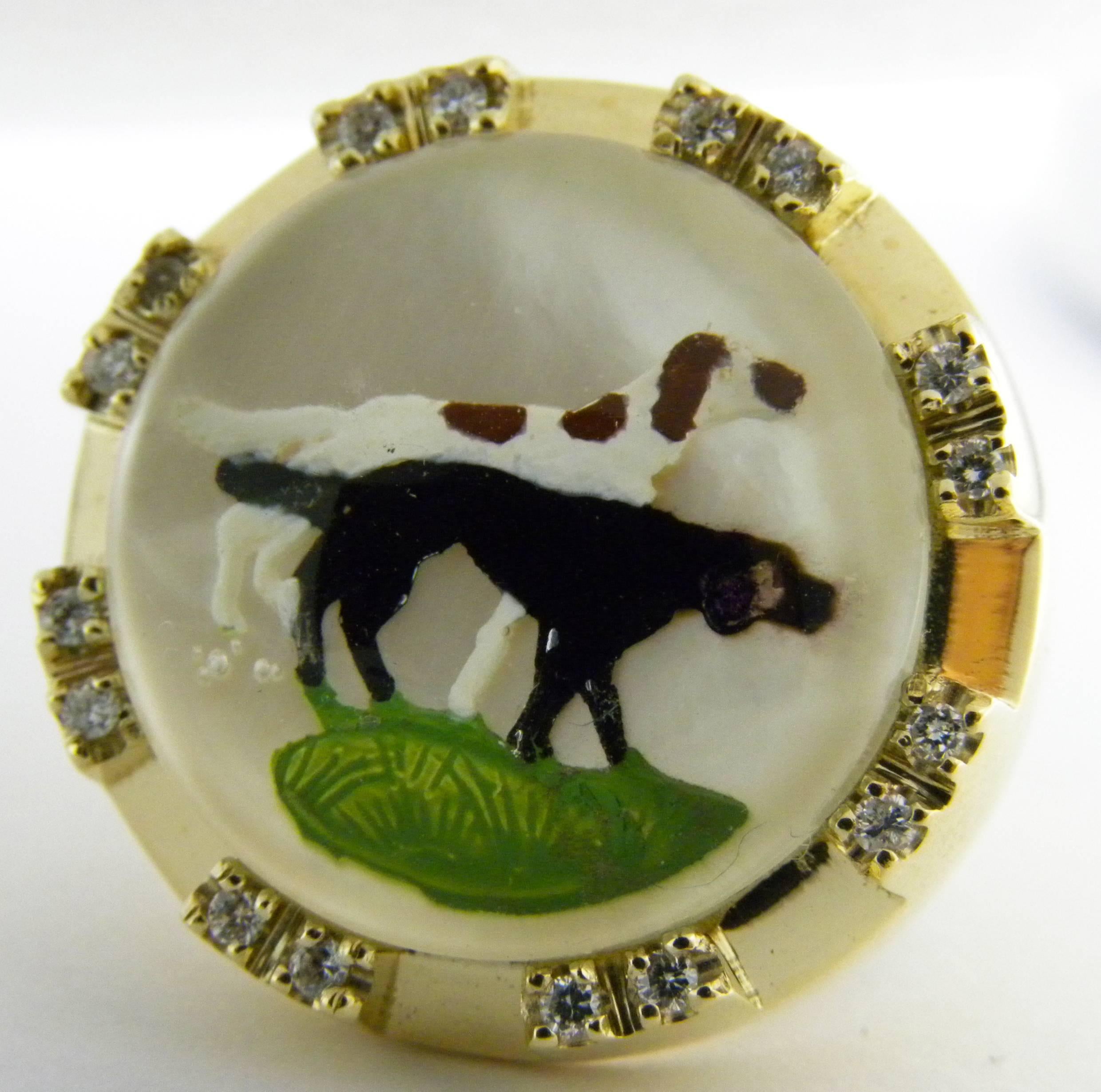 Essex Glasses or Reverse Painting Under Crystal featuring two hounds in a diamond and yellow gold signet ring setting.
The multicolor painting creates an unusual three-dimensional effect.
Giovanni Berca loved Essex Glasses and used to collect them