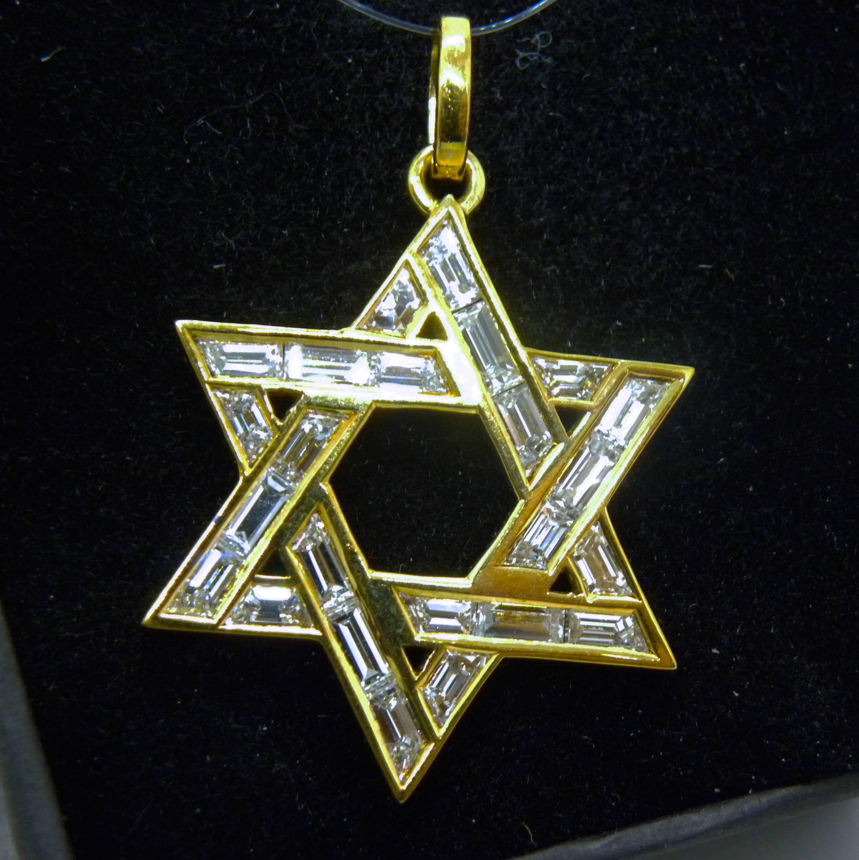 One-of-a-kind, Original Seventies Awesome Star of David Pendant featuring 2.97 Carat White Diamond Baguette Cut (D-E,IF Collection) in a 18 Carat Yellow Gold Setting.
In our fitted Burgundy Leather Case
A detailed gemological certificate is