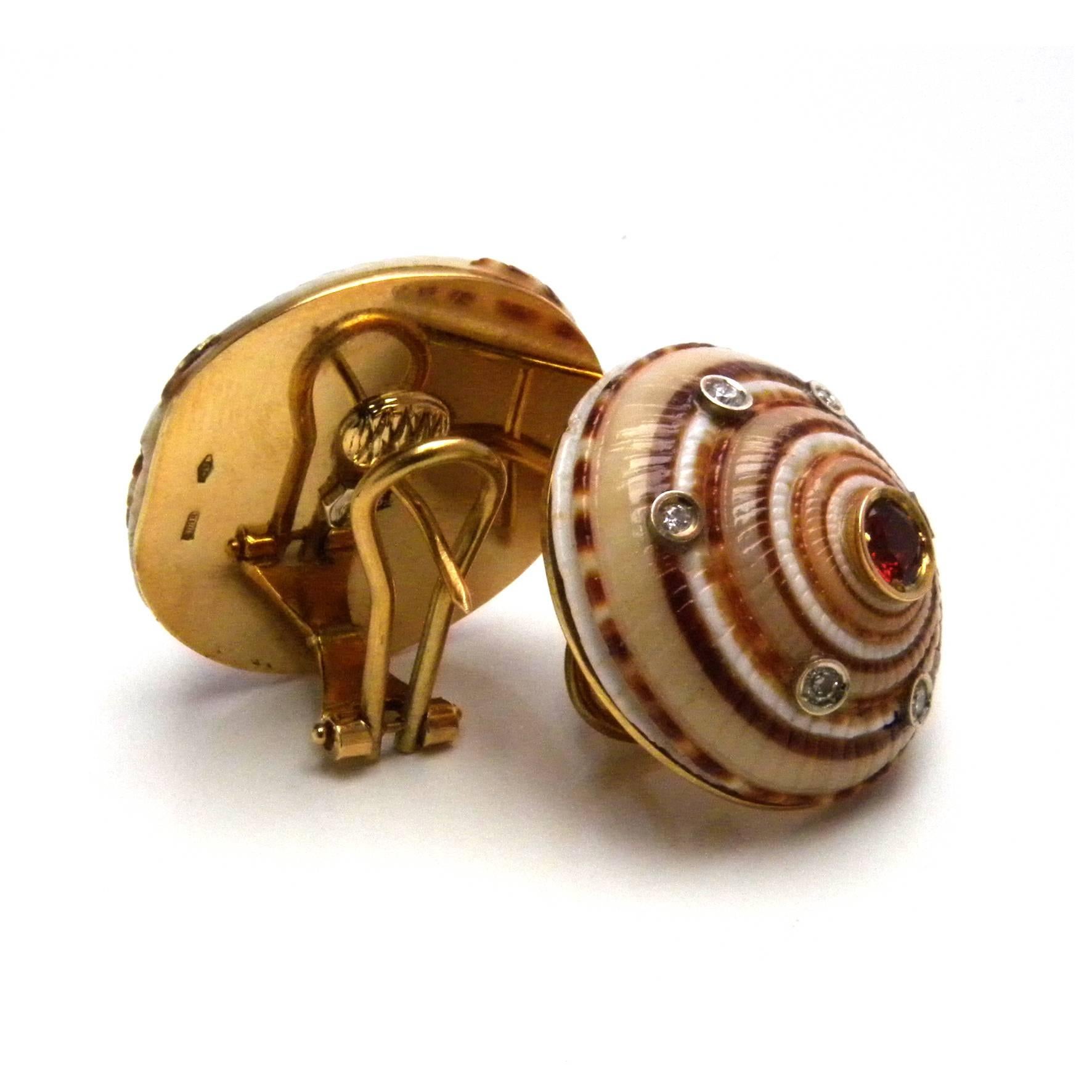 Unique seashells earrings with a 18kt Yellow gold back, set with round red tourmalines(0.8kt) and White diamonds(0.19kt).

Complimentary import tax and duties for Europe and US shipments.
