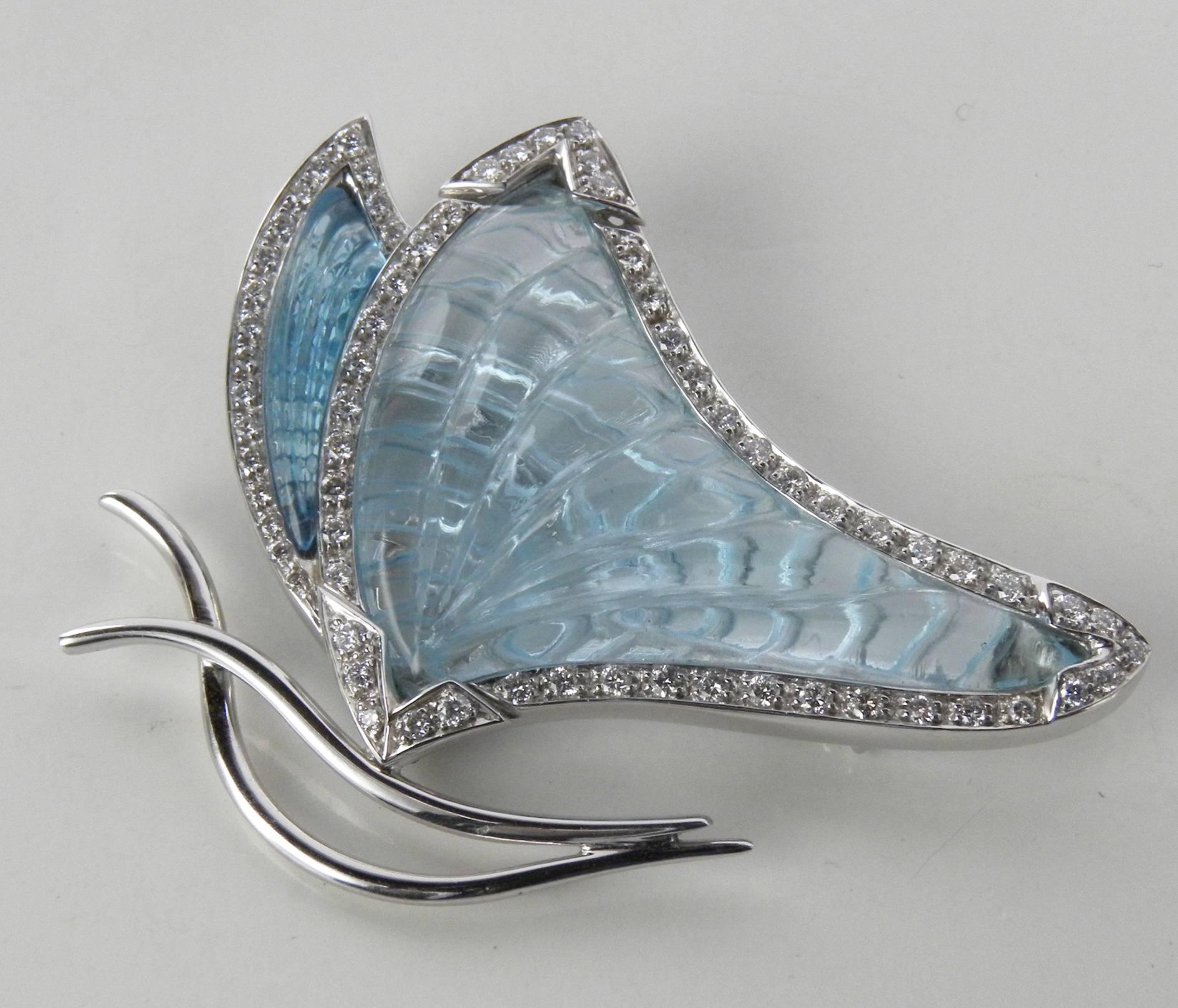 Natural hand inlaid aquamarine (25 Carat) and natural light blue topaz(5 Carat), white diamond setting(0.95 Carat, F-G, Vs1), an extraordinary butterfly brooch: not simply a jewel, a beautiful work of contemporary art. 18 Carat White Gold.
