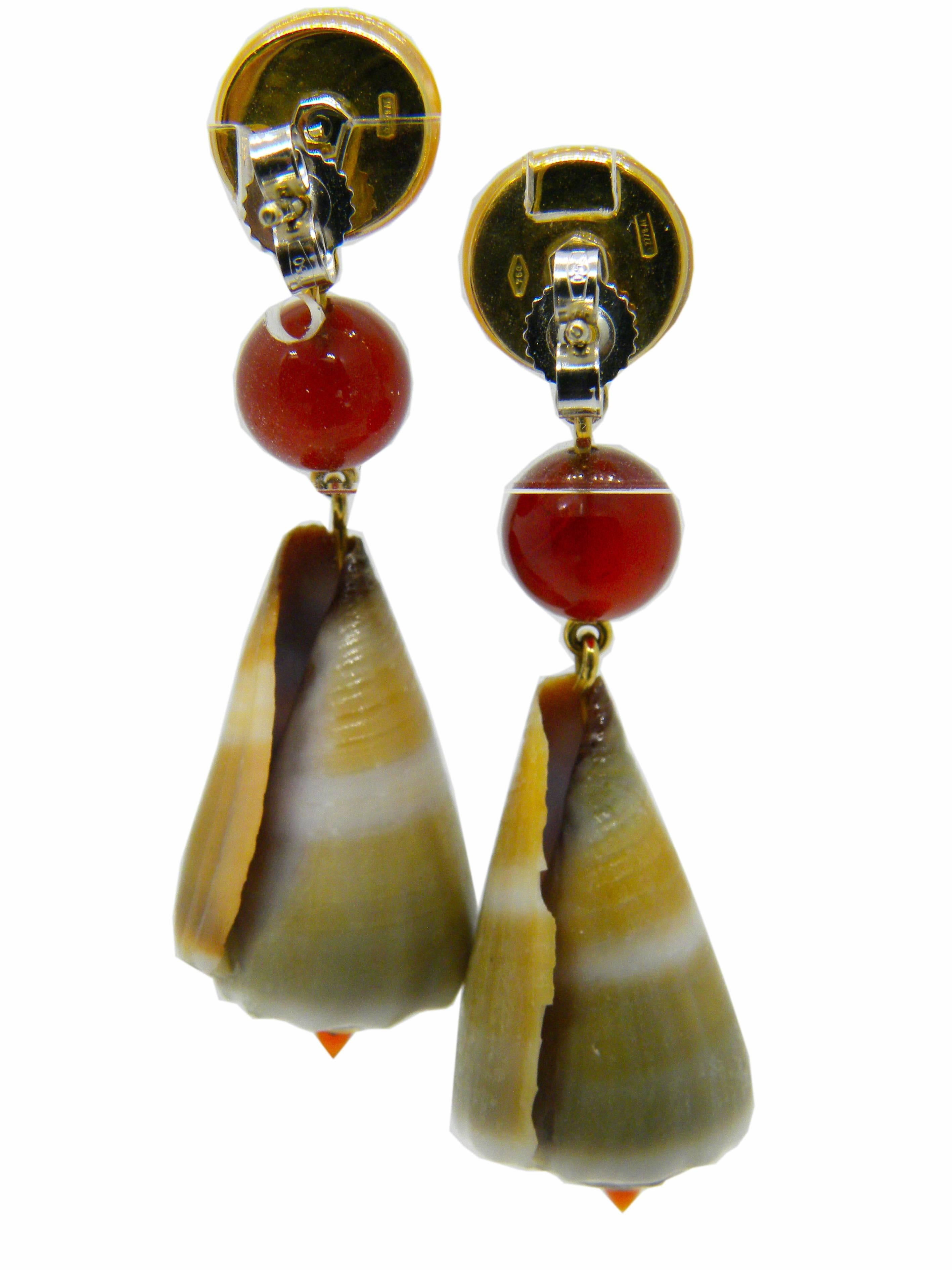 One-of-a-kind drop earrings featuring 0.22 Carat Yellow Sapphire in an orange mother-of-pearl cabochon setting, Natural Conus Muriculatus Seashell(Muricate Cone), Carnelian Pearls and Cabochon, 4.40g 18 Carat Yellow Gold

Total Lenght 5.50cm