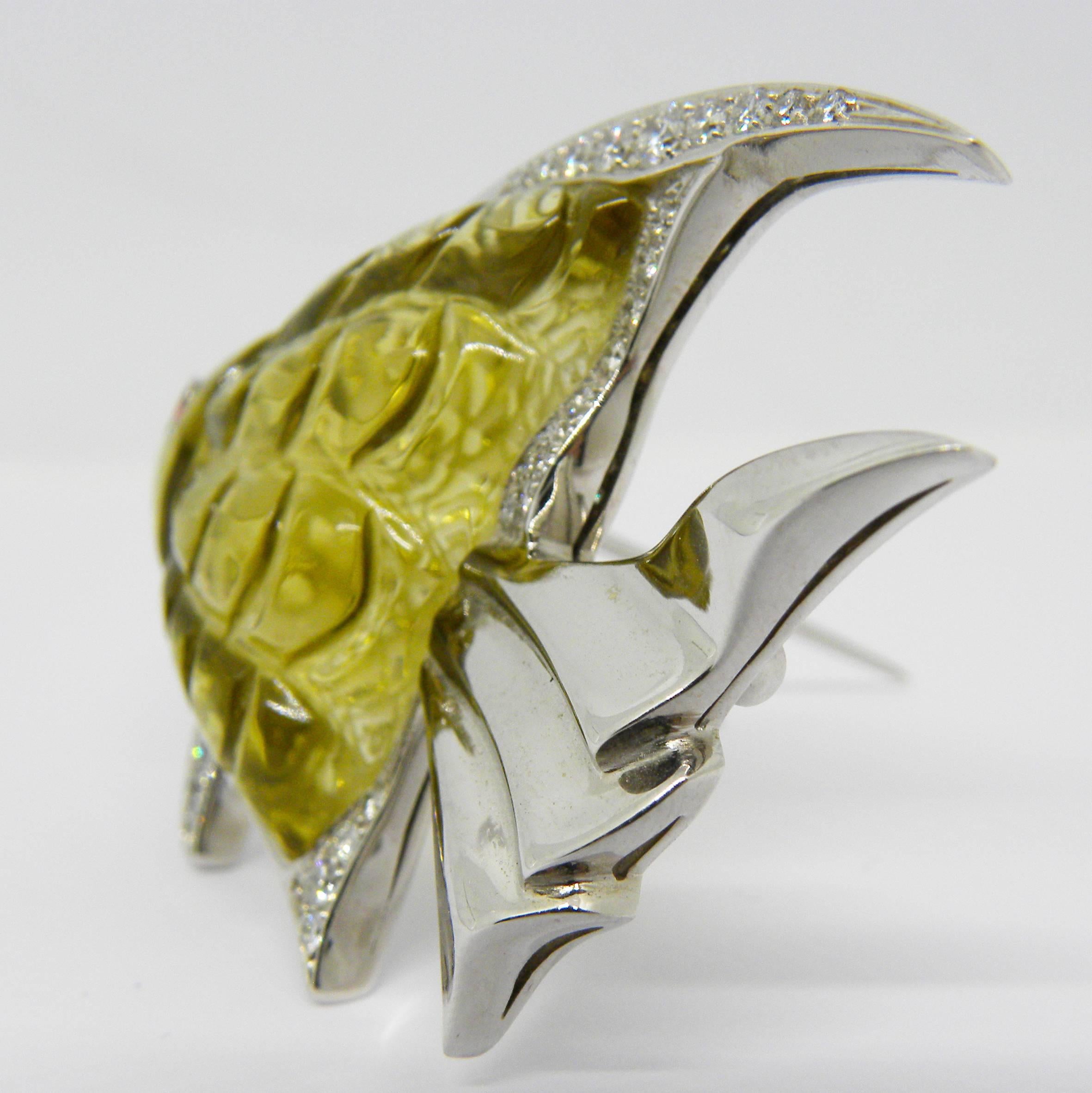 Extraordinary, unique yet timeless 43.25 Carat hand inlaid, hand carved natural lemon quartz, 0.81 Carat top quality white diamond(D-E, IF), 0.05Carat  natural Ruby,  18k white gold setting Angelfish  brooch.
This special, one-of-a-kind piece has