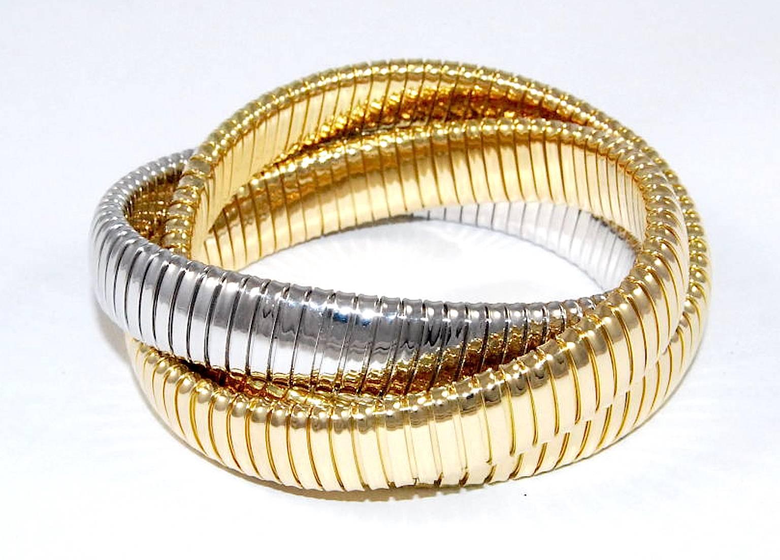 Carlo Weingrill original rolling bracelet in 12mm width. It was 1989 when Carlo Weingrill started to produce this iconic bracelet. It is three 12mm tubogas strands intertwined where you can combine colors and size.
18carat gold