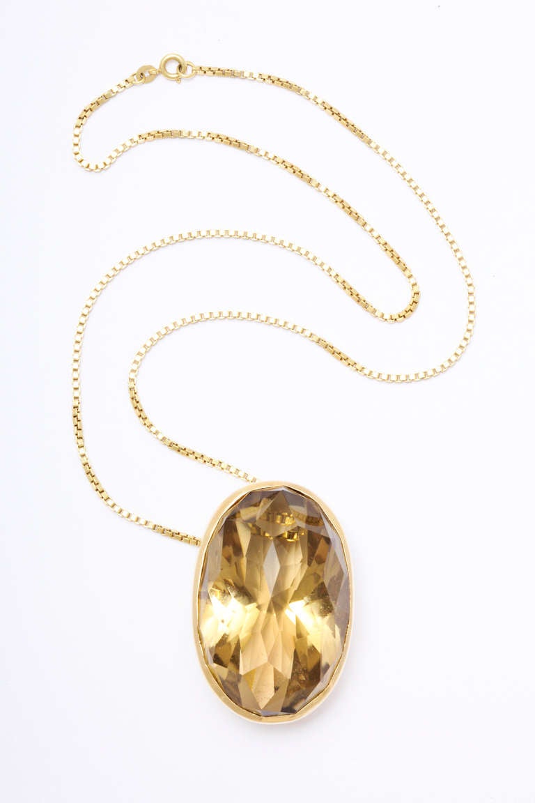Oval citrine pendant in modern 18k gold setting. The citrine weighs 365 carats but that includes the gold mounting. The stone is approximately 2