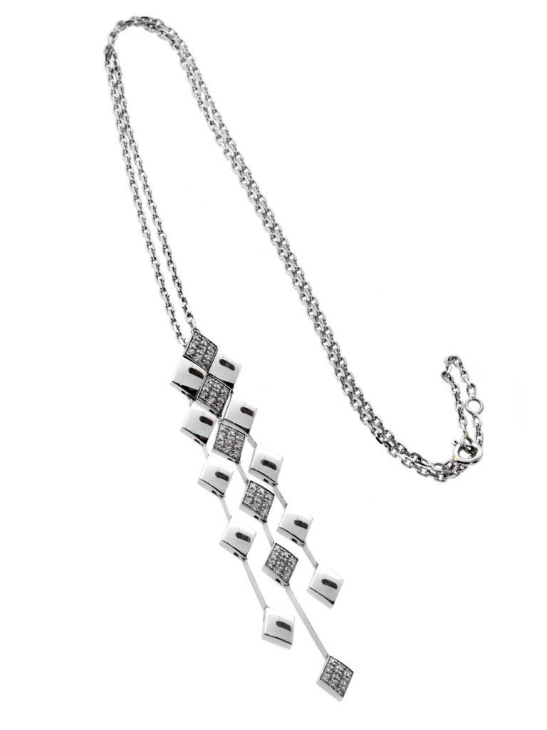 A timeless Chanel quilted necklace enhanced with the finest Chanel round brilliant cut diamonds set in 18k white gold.

Pendant Dimensions: .47″ wide by 2.63″ in length
Necklace Length: 15 1/2″

Inventory ID: 0000016