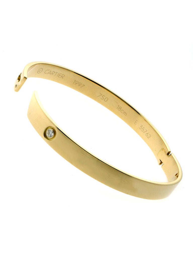 Stunning 18k Yellow Gold Diamond bangle, set with a Vvs1 E Color Diamond on this Cartier Anniversary Bracelet which helps transform an already-luxurious piece into something special. If you’re looking for the most fabulous way to say “I Love You” to