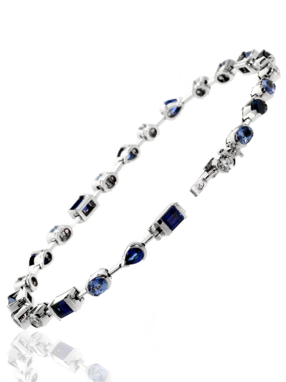 A fabulous authentic Cartier tennis bracelet featuring a mix of rich blue sapphires (3.79ct) and the finest round brilliant cut diamonds (.63ct) set in 18k white gold.

Length: 6 1/2″
Dimensions: .13