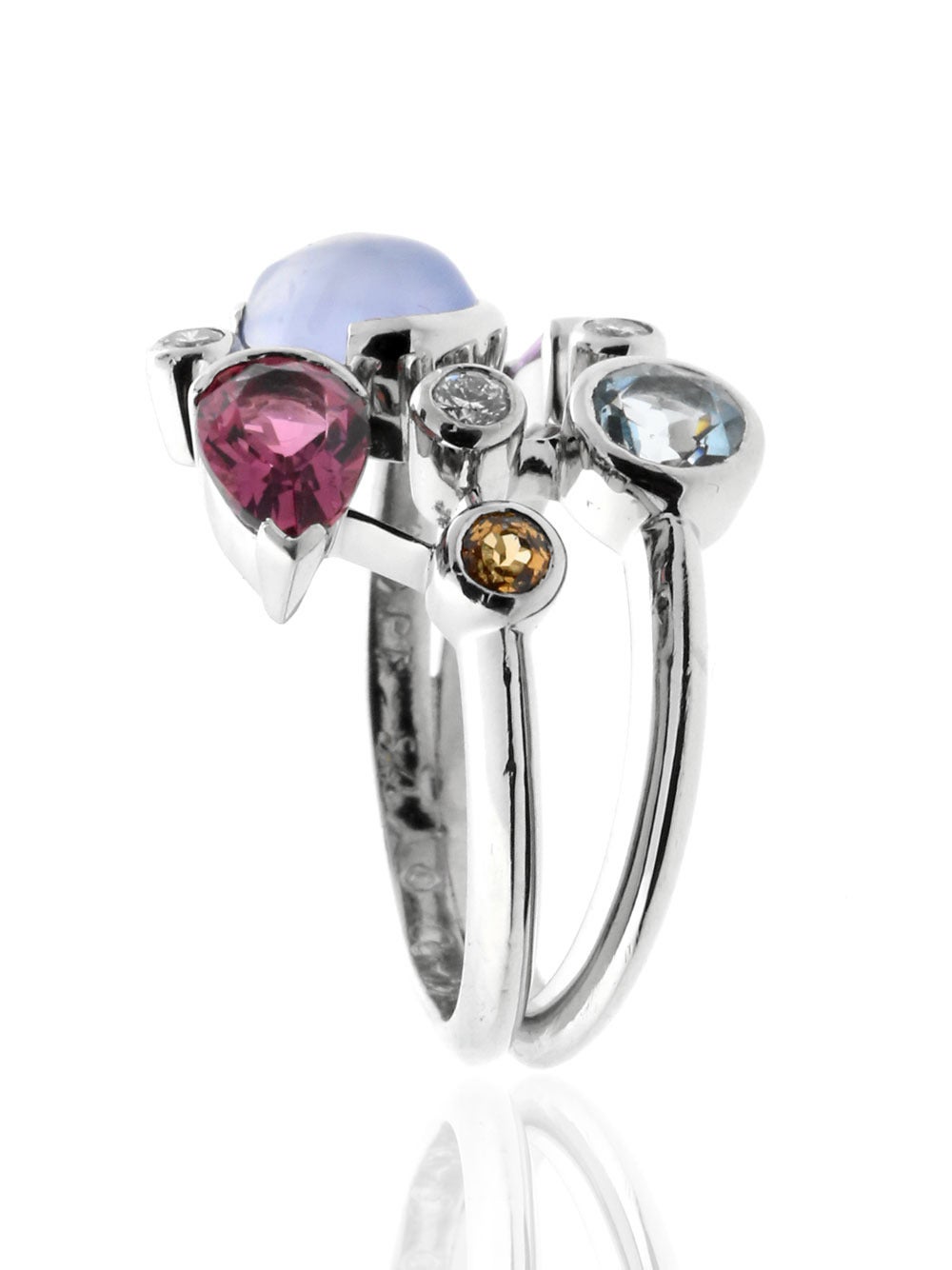 A playful plethora of diamonds and gemstones in this beautiful ring by Cartier from the Meli Melo collection. Crafted in Platinum, Sz 54 / US 6, the ring measures 18mm wide.