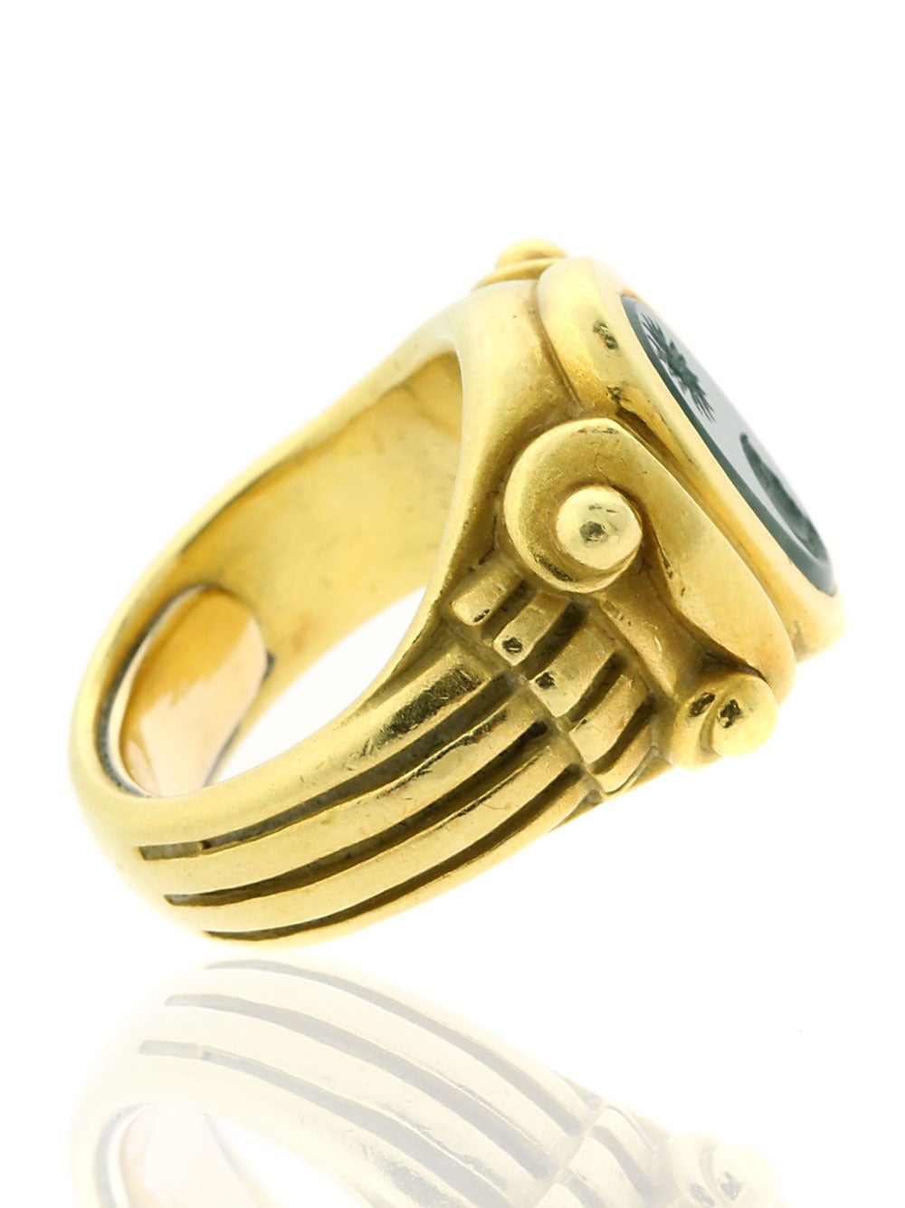 A unique ring by Kieselstein Cord featuring a hand carved bloodstone crafted in 18k Yellow Gold. The ring has a length of 14mm, Sz 3 (Resizeable), and has a total weight of 17.2 grams.