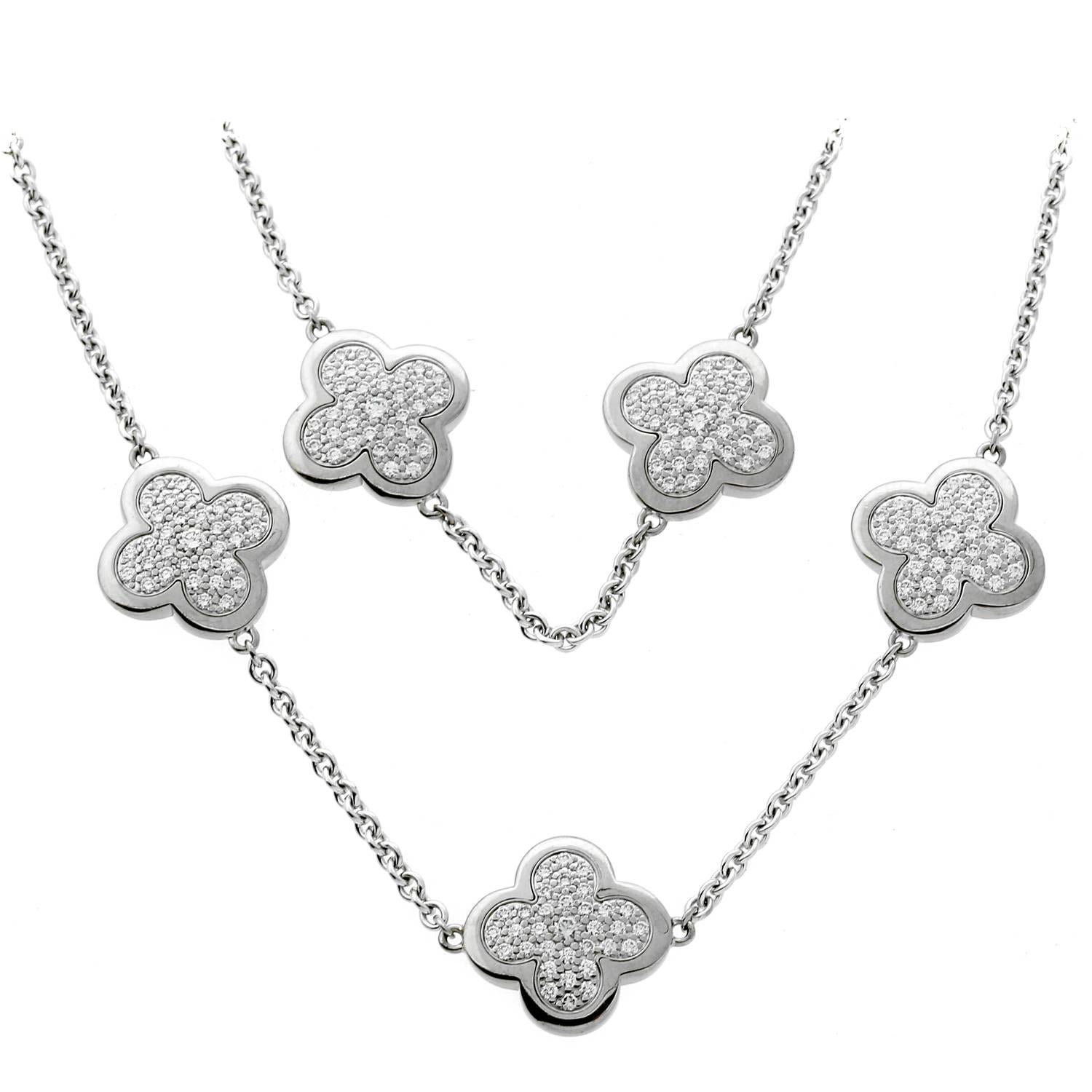 An iconic authentic Van Cleef & Arpels necklace featuring 9 motifs set with the finest Van Cleef & Arpels round brilliant cut diamonds in 18k white gold. 

The necklace measures 16