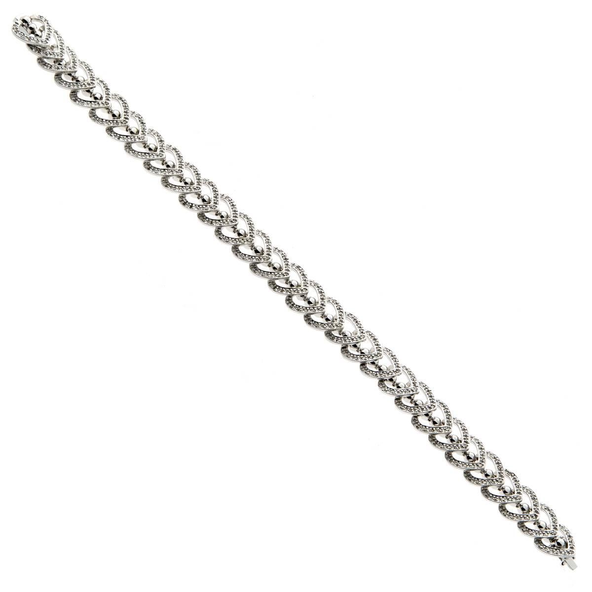 A fabulous bracelet featuring round brilliant cut diamonds set in 14k white gold, this fun bracelet features a free flowing design which is sure to grab attention!

The bracelet measures 7.5