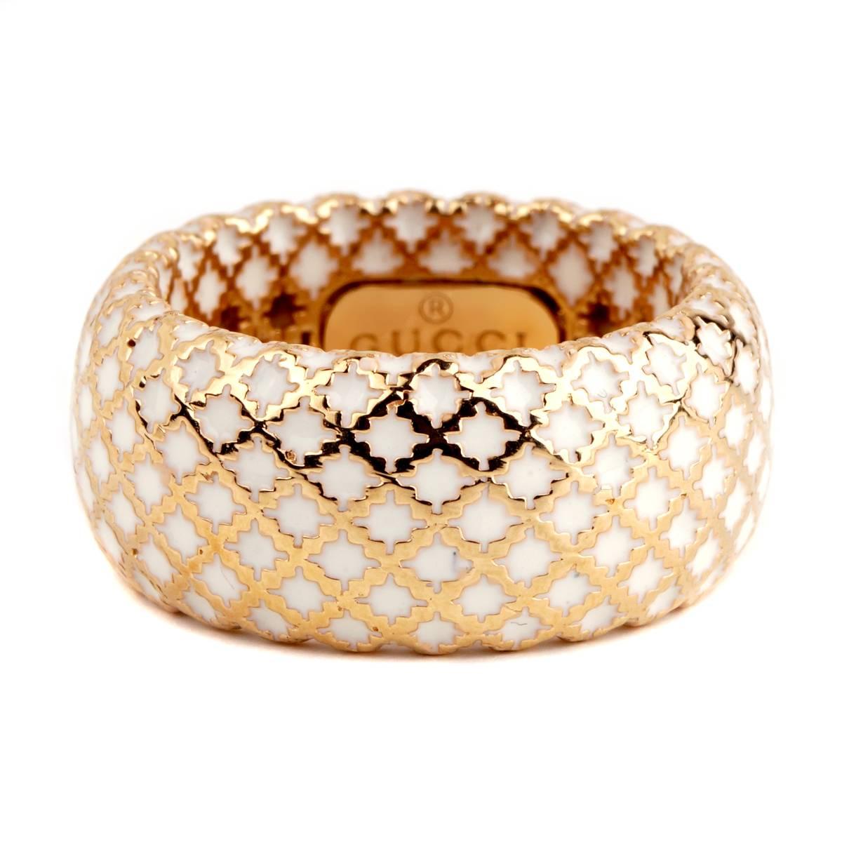 A fabulous Gucci ring part of the Diamantissima collection, featuring a crisscross pattern with white enamel expertly placed along the inside. 

Size 6, 
Width .39