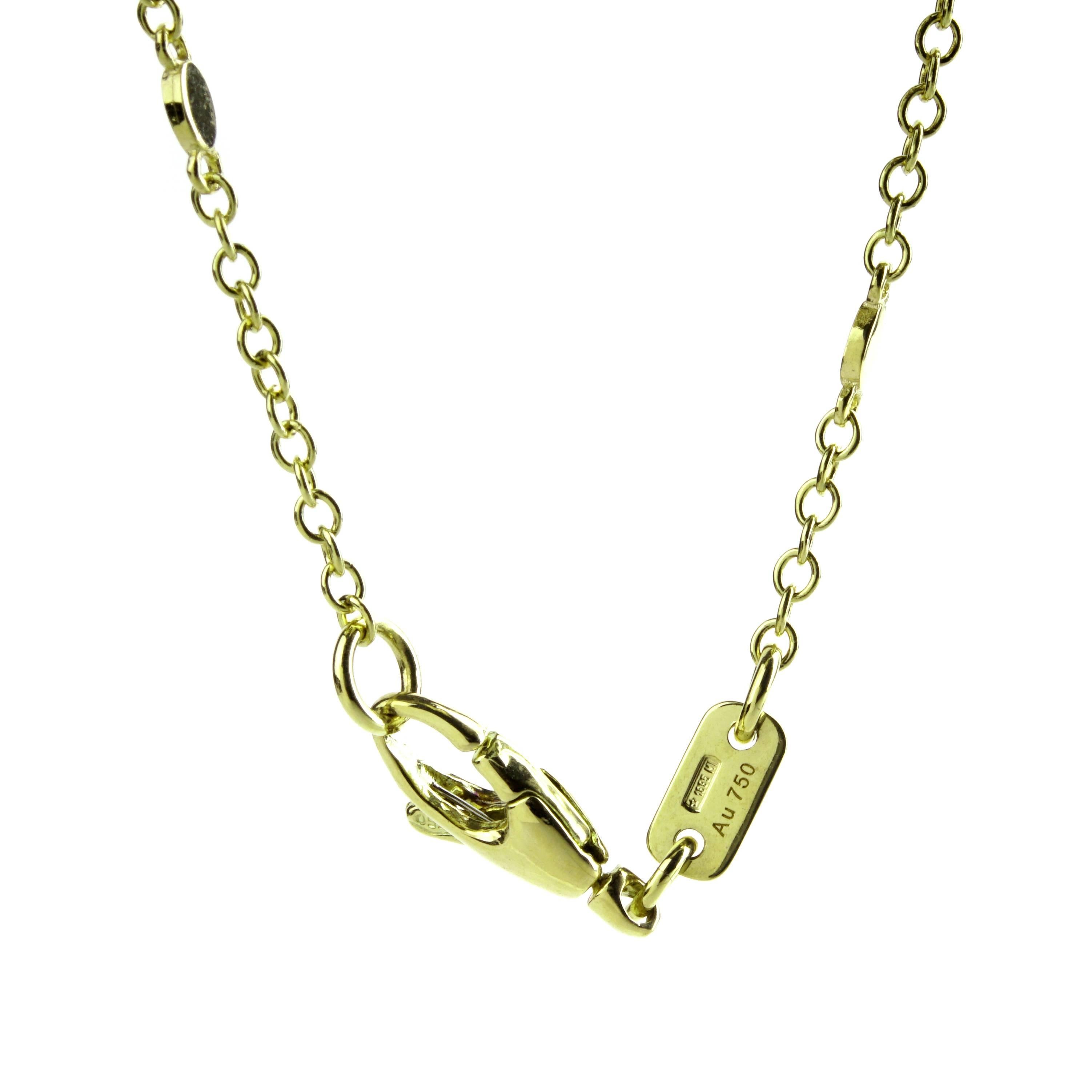 A playful Gucci pendant featuring the Double G motif cut out along side with white enamel flowers and petals in 18k yellow gold. Necklace Length: 16