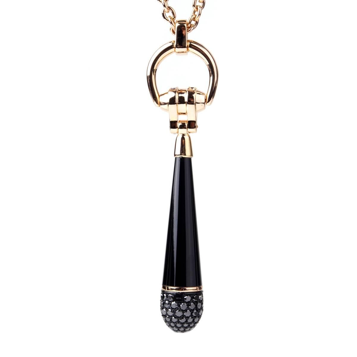 The 18-karat pink gold Horsebit Necklace from Gucci is an attention-grabbing piece. Featuring black diamonds and black corundum formed into an obelisk shaped pendant, the necklace is made to last. In addition, the horsebit design elements are a