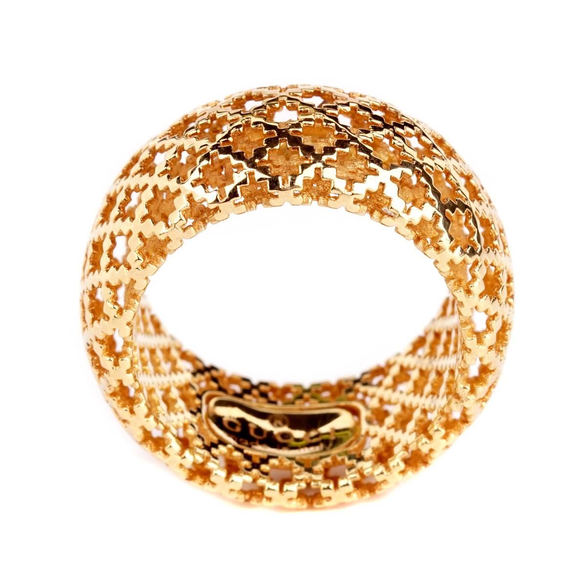 A fine Gucci iconic ring from the Diamantissima collecton featuring an open pattern eternity design in 18k yellow gold.  Size 5.5 Width: .39