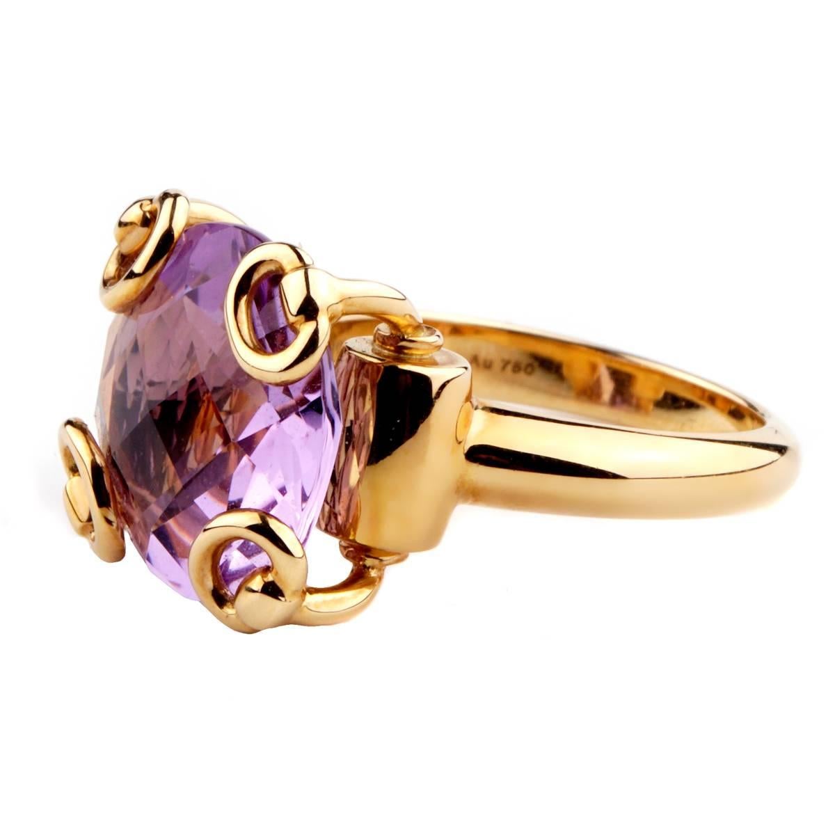 A fabulous Gucci ring showcasing a round checkerboard cut amethyst encased in 18k yellow gold.

Size 6.25 
