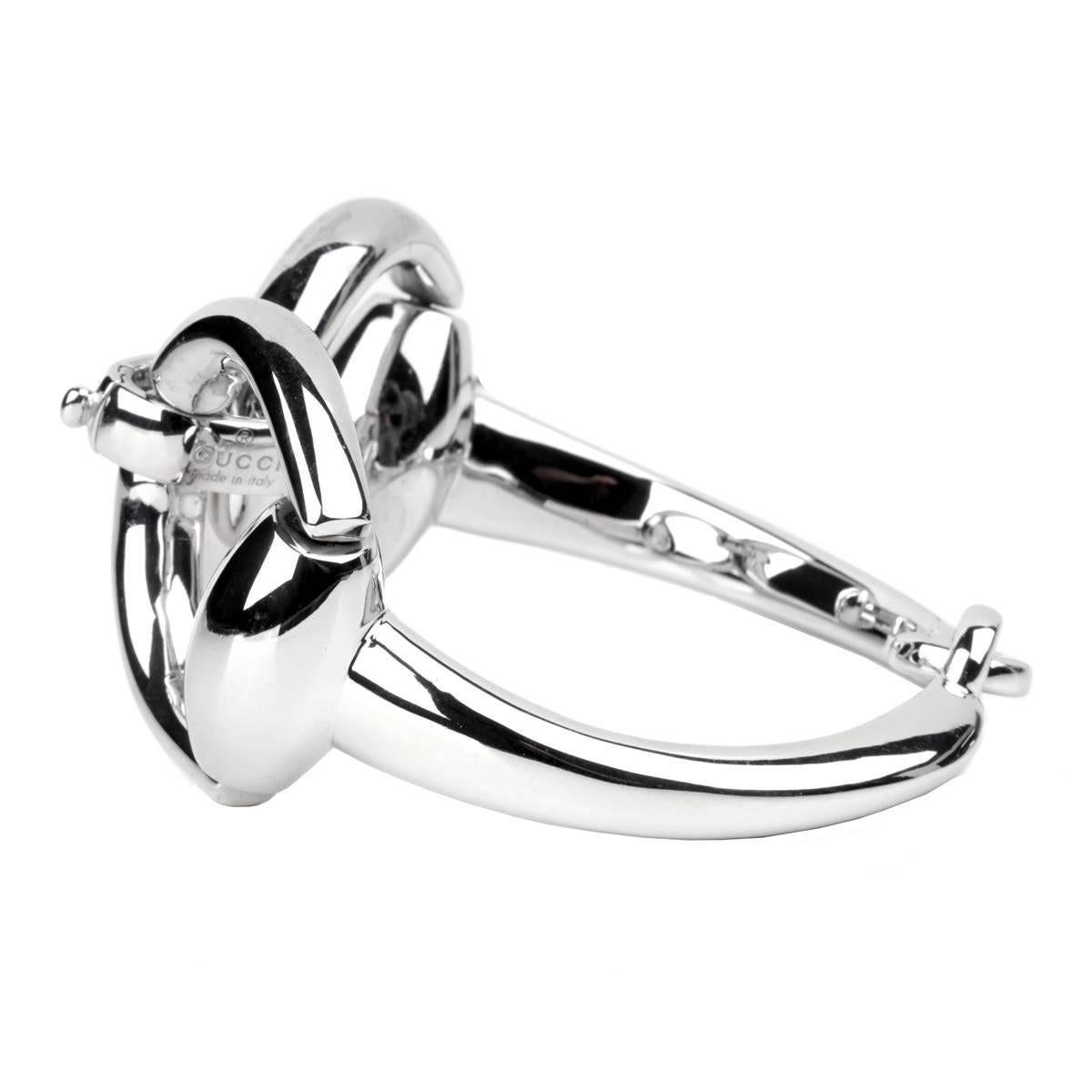 A fabulous Gucci bangle is sterling silver displaying the iconic Horsebit motif. The bracelet measures 7