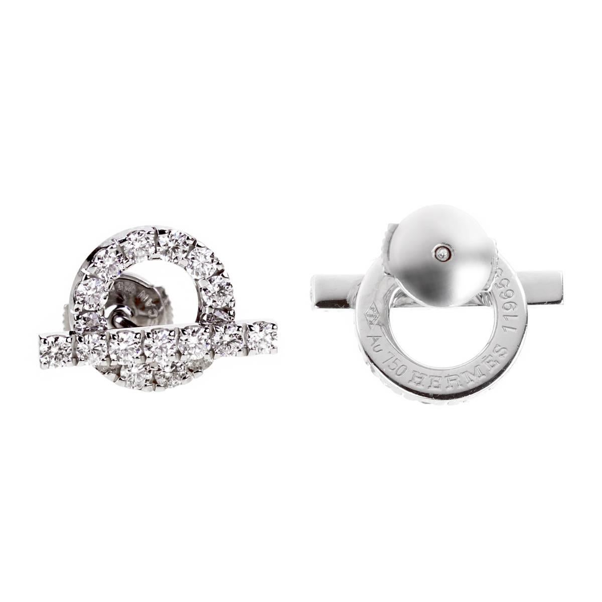 A stunning pair of Hermes earrings featuring 1.14 of the finest Vvs Hermes round brilliant cut diamonds in 18k white gold. The earrings measure .60
