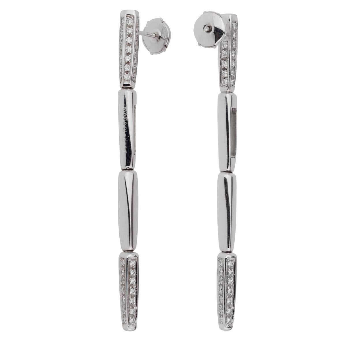 A sleek pair of Gucci earrings featuring 136 round brilliant cut diamonds set in 18k white gold. The earrings mreasure .15