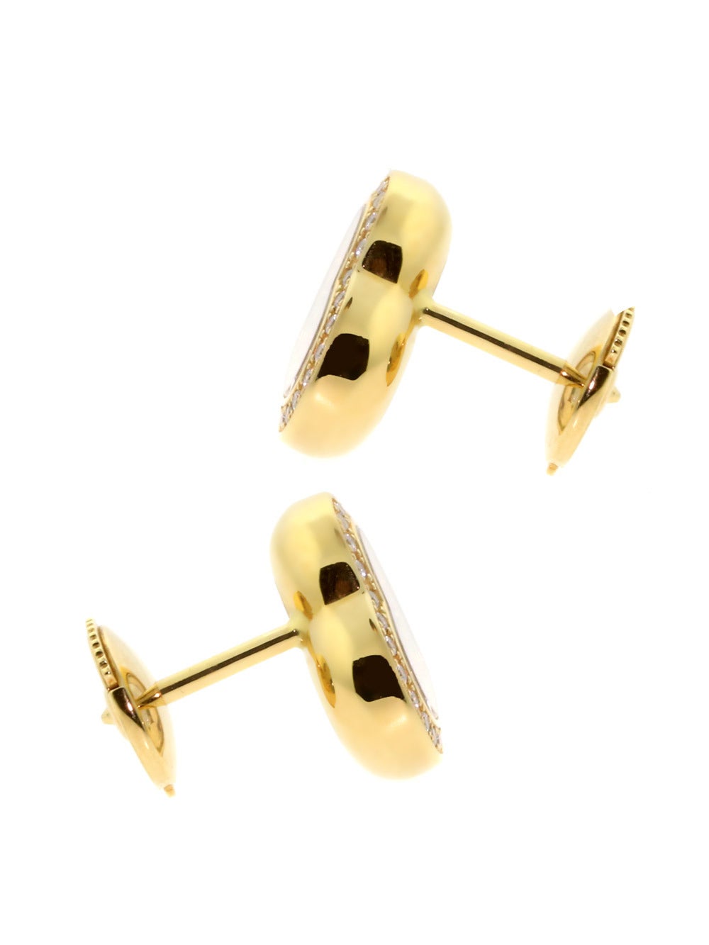 A fabulous authentic pair of Chopard Happy Diamond earrings featuring 56 of the finest Chopard round brilliant cut diamonds set in these 18k yellow gold breathtaking earrings.

Dimensions: 12mm in Diameter (.47″ Inches)
Condition: