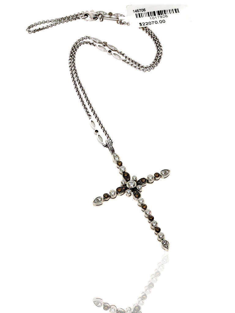 Chopard Diamond Cross necklace crafted out 18k White Gold, adorned with appx 3 cts of Vvs1 E-F Color White & Champagne Diamonds. The pendant measures 66mm (2.59