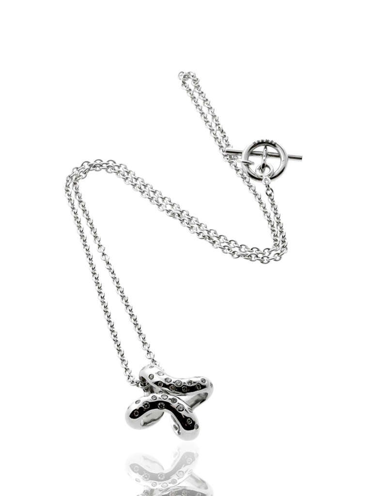 A chic authentic Hermes necklace enhanced with the finest Hermes round brilliant cut diamonds in 18k white gold.

Necklace Length: 14″
Dimensions: 0.78″ Inches in diameter

Inventory ID: 0000267
