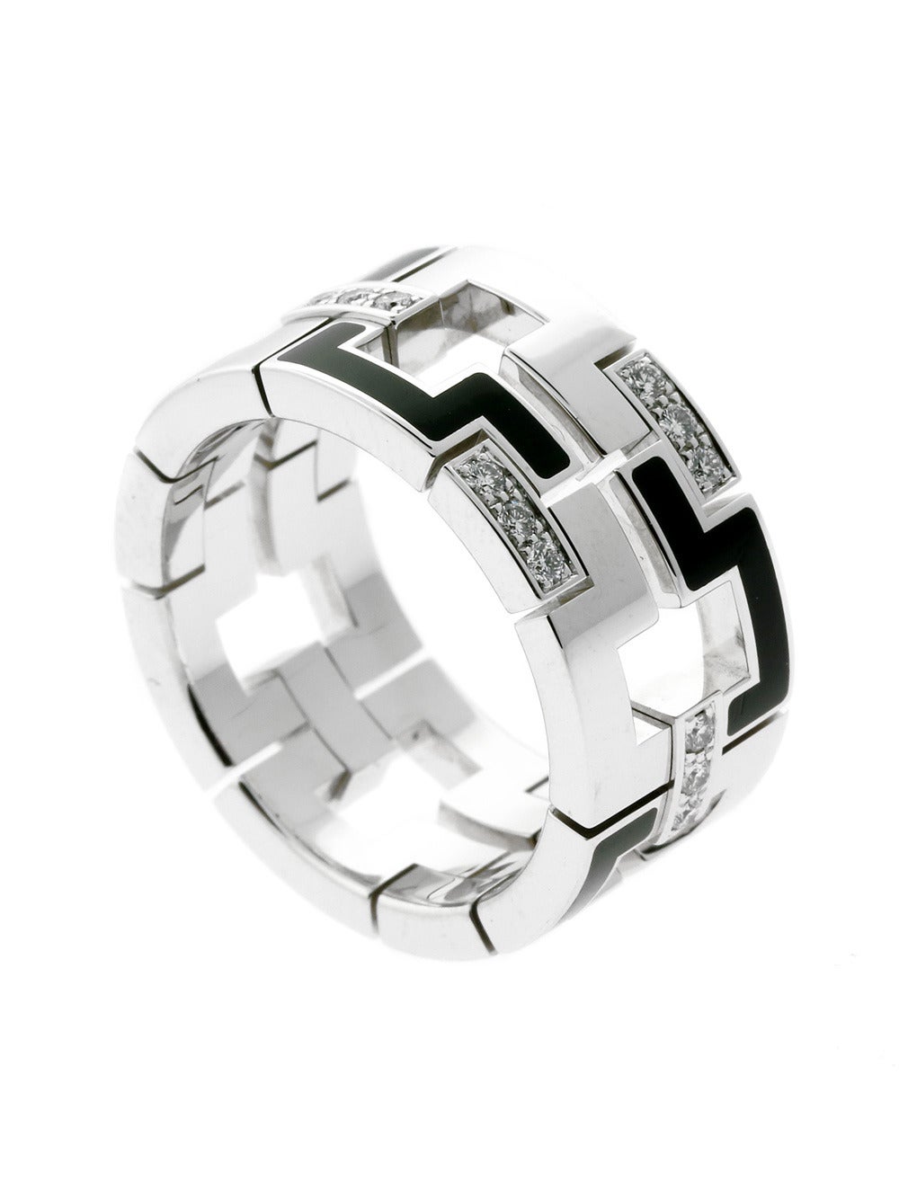 Composed of smooth 18k White Gold and boasting an engraving of the world-famous Cartier logo, this piece features an incredible amount of detail and symmetry. Artistic and attractive all at once!

The ring measures a sz 9 1/4, with a weight of