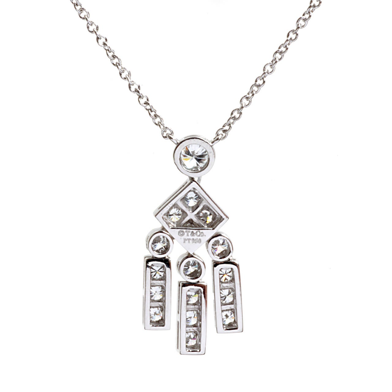 Radiance is the hallmark of this gleaming Platinum necklace from Tiffany & Co.’s Legacy collection. 17 Round Brilliant Cut Diamonds are prominently placed in all 4 segments of the pendant, which is itself composed of dangling Platinum circles,